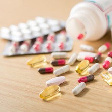 An image showing various pills spilled out on table