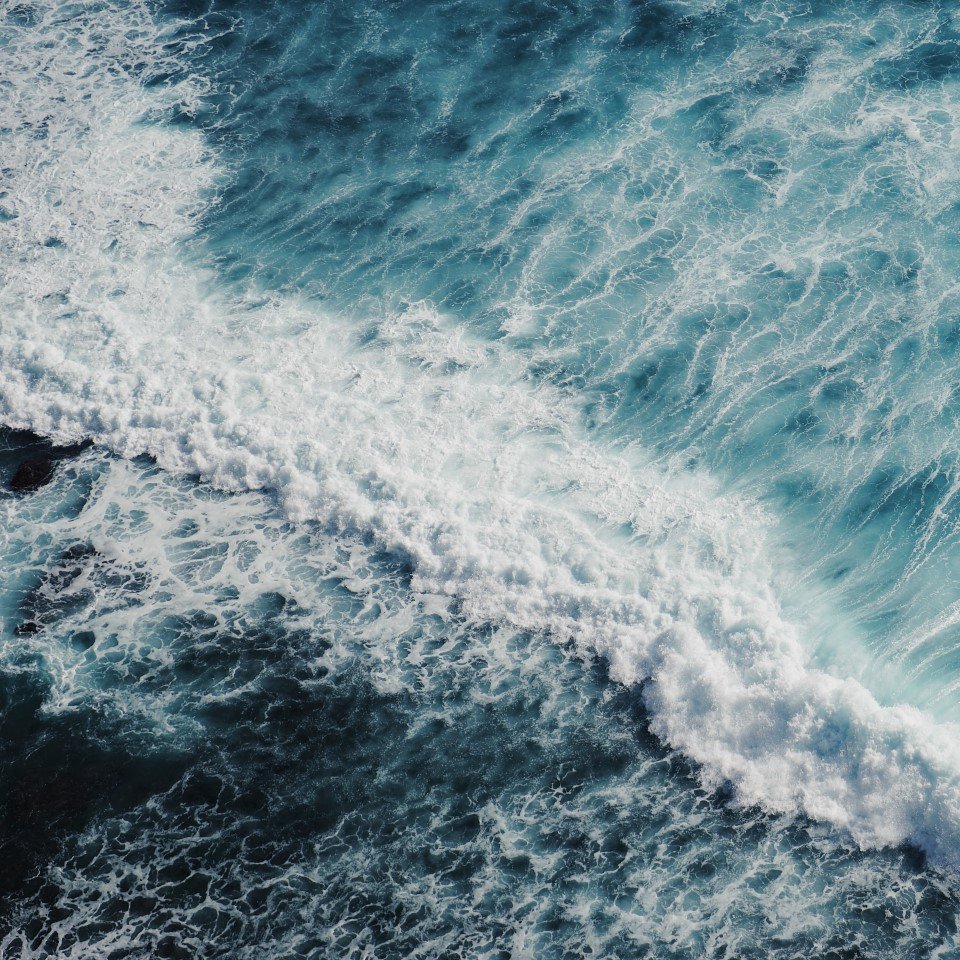 Aerial view of waves in the ocean.
