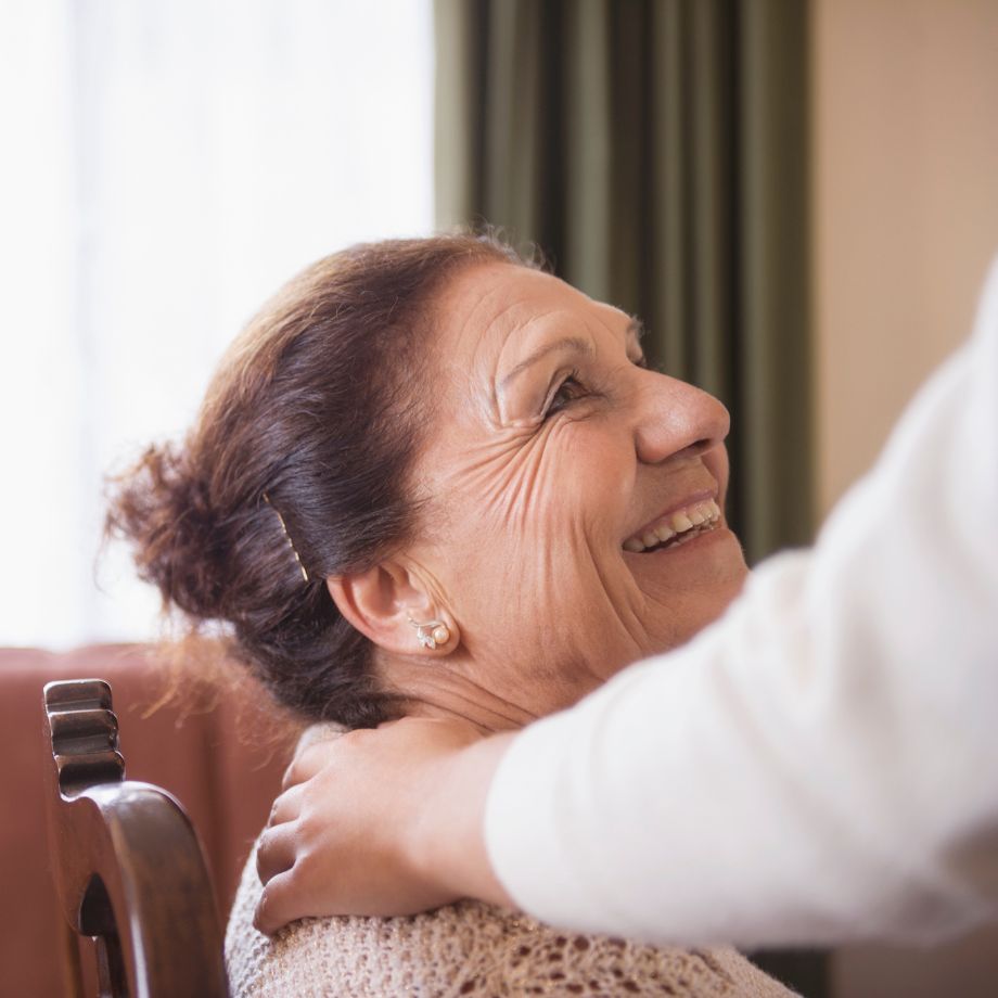 Image of a lady smiling at her carer